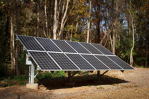 Solar panels in the field by the pavilion